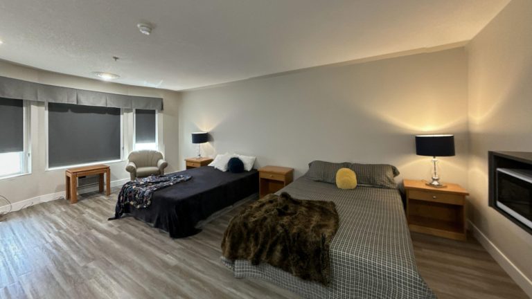 2-Queen-Beds-Studio-Whitecourt-1-Living-Room 1